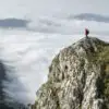 Climber standing high on a mountain to show altitude sickness