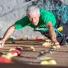 70-year-old mad climbing a bouldering wall wondering if he is too old to start bouldering
